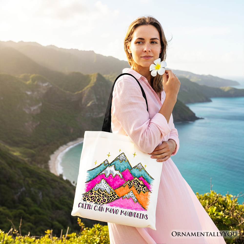 White tote bag with white handles, colorful mountains and leopard graphic with text