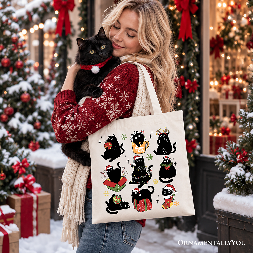 White tote bag with cartoon black cats, Santa hats, and small holiday icons