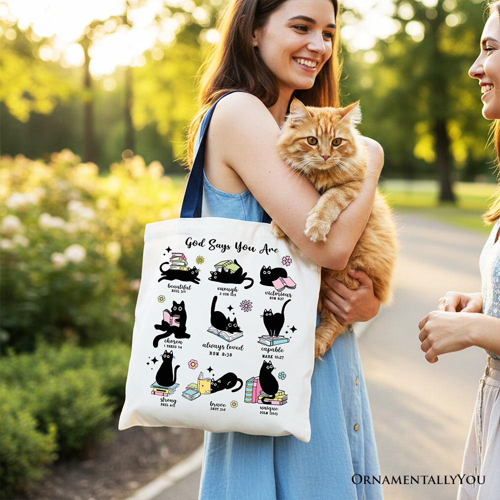 White tote bag with cat illustration cluster and faith text on front