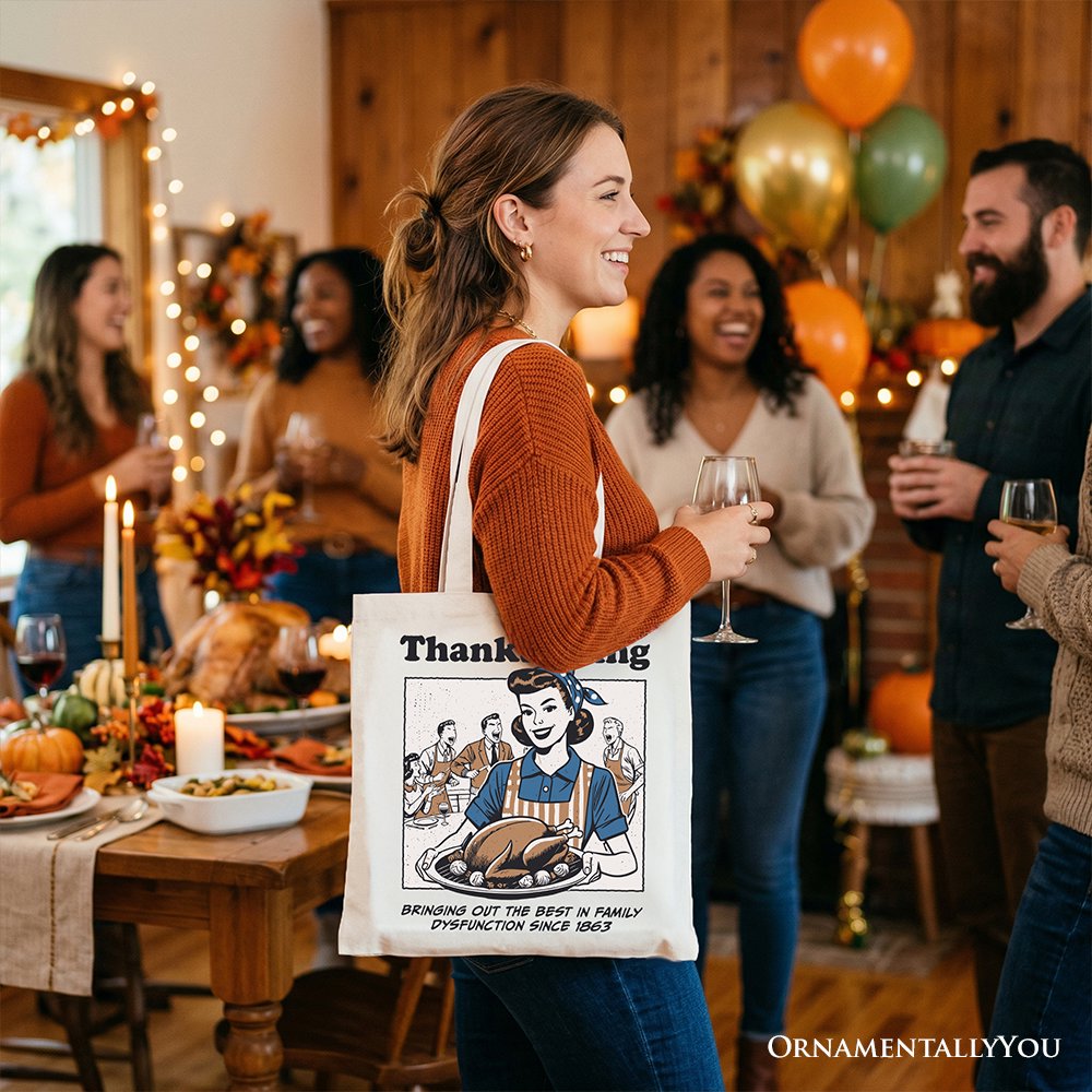 White tote bag with Thanksgiving front print, carried in side view by a person.