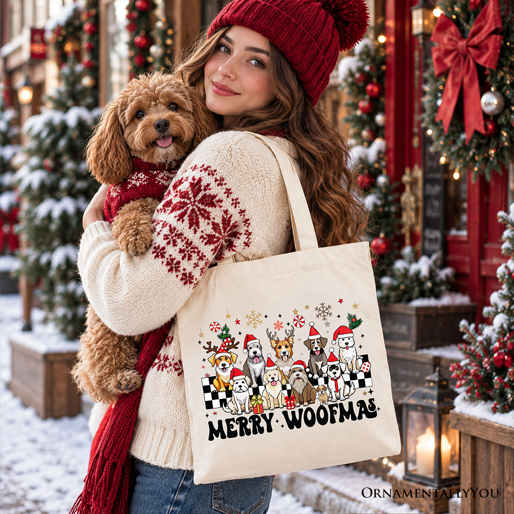 Beige cotton tote bag with Merry Woofmas dog graphic held with beige handles