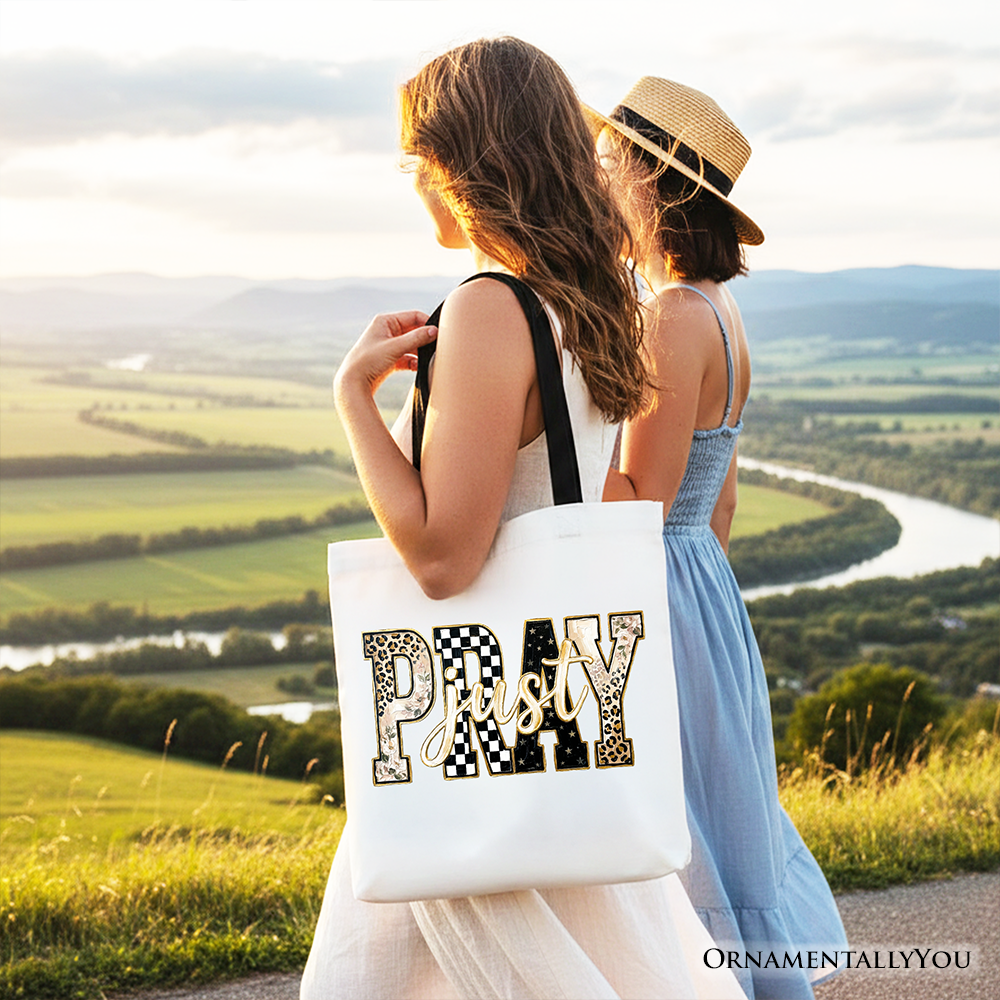 White tote bag shown from the back with “Pray” patchwork front graphic