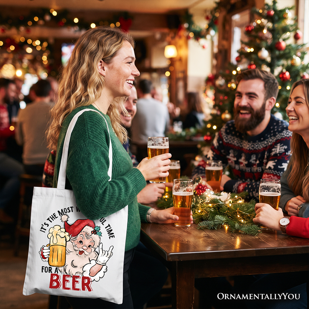 White Christmas beer tote bag with Santa mug graphic hanging at a woman’s side