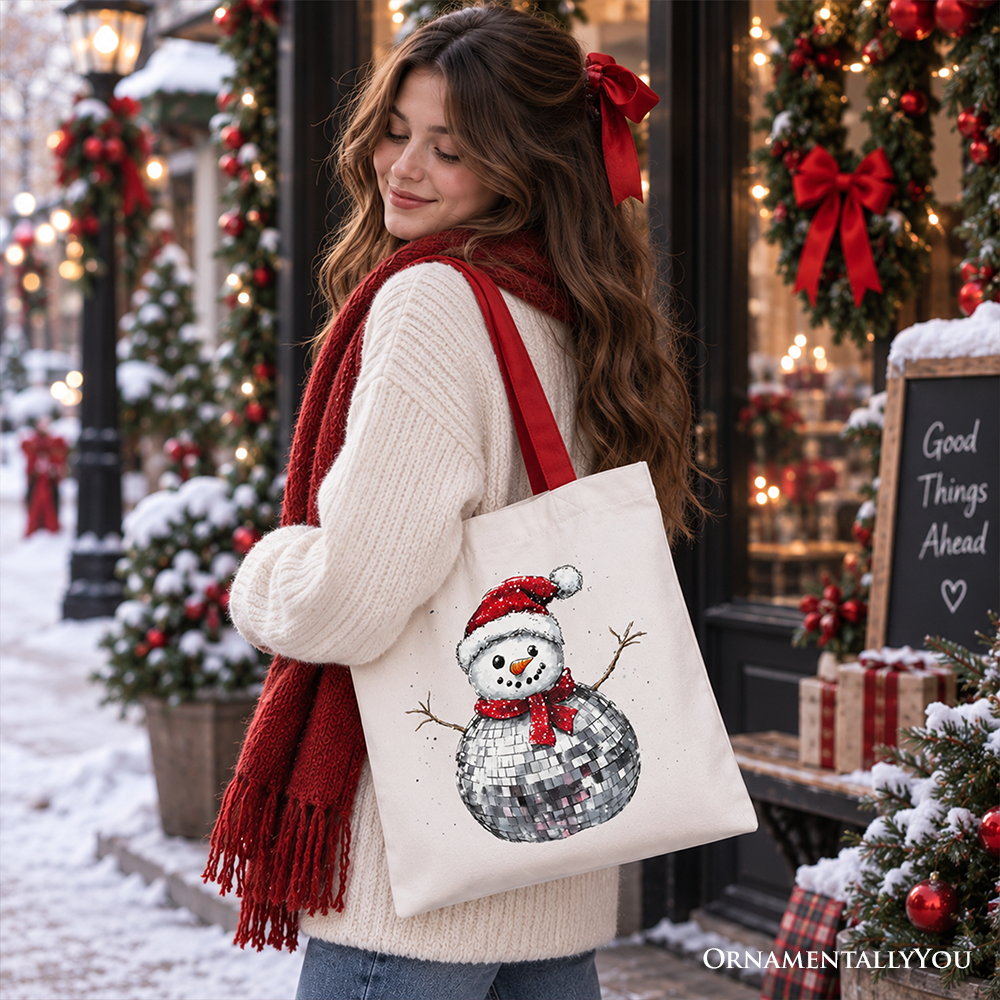 White tote bag with disco snowman graphic and red handles