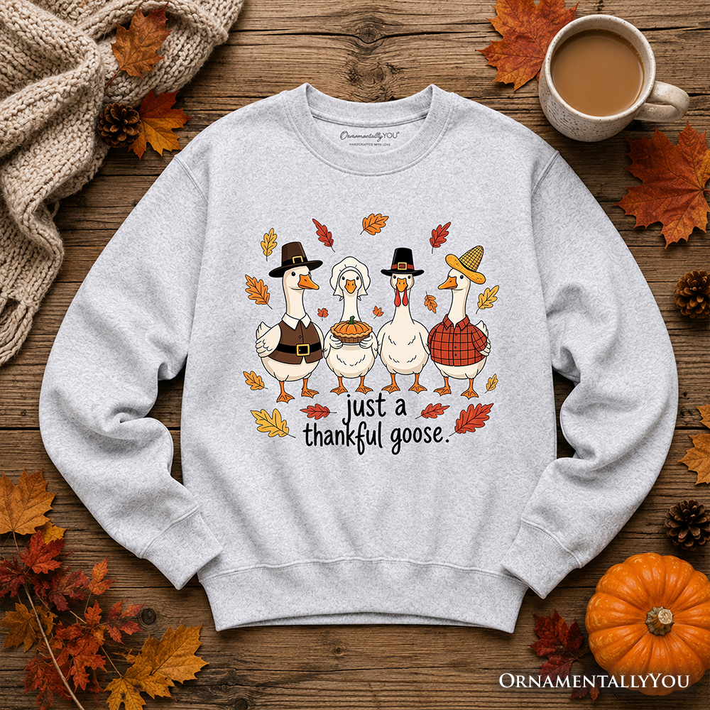 Light gray sweatshirt laid flat with “just a thankful goose” turkey graphic