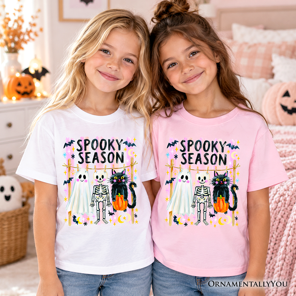 Kids Halloween T-shirt: white and pink with colorful 'Spooky Season' skeleton cat graphic