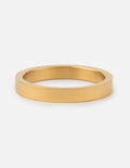 Gold flat band ring with a wide smooth profile