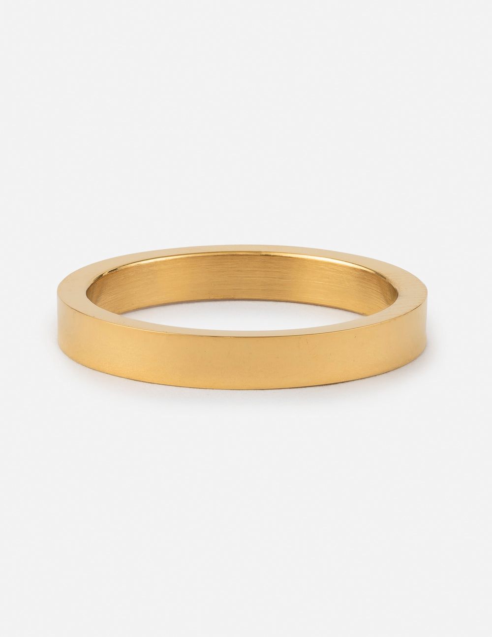 Gold flat band ring with a wide smooth profile