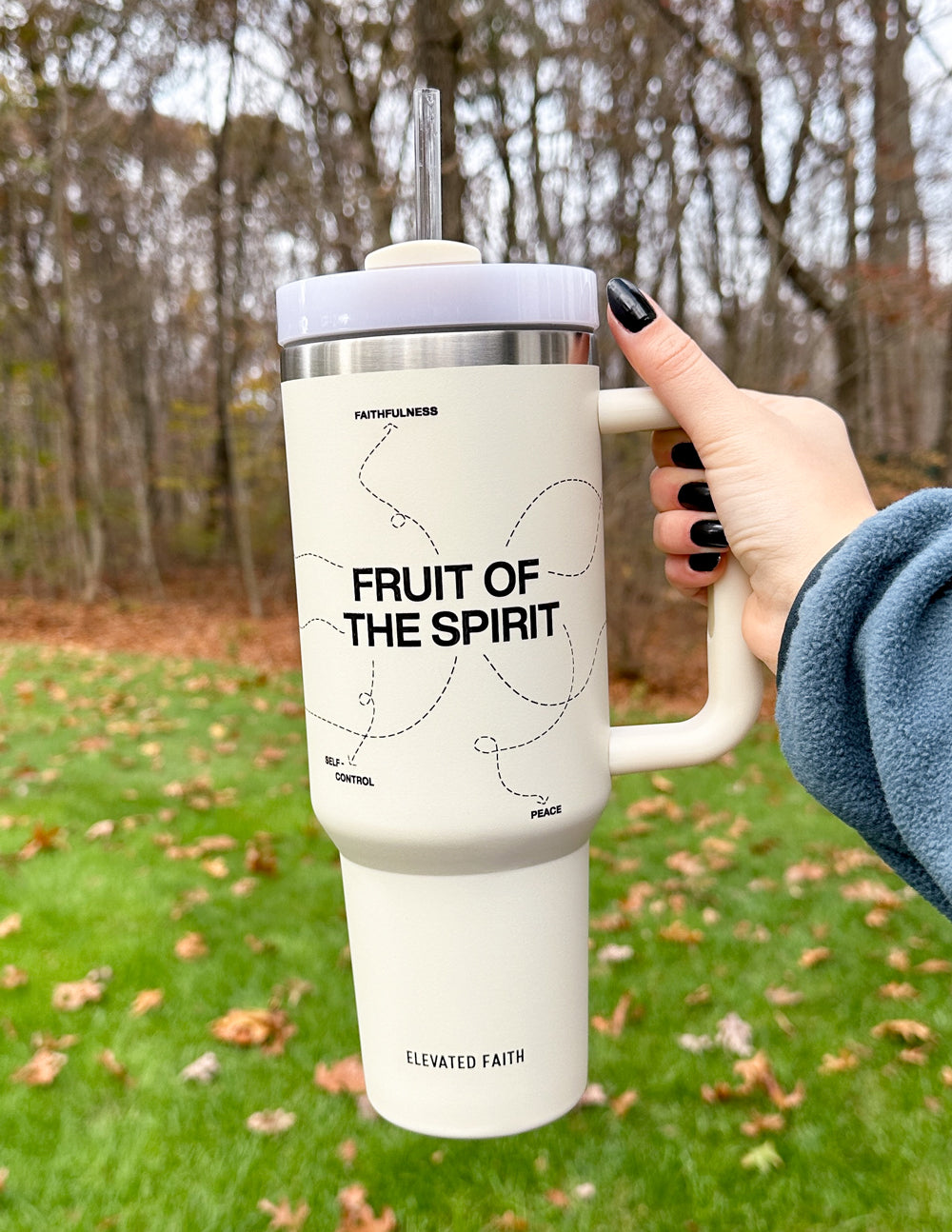 White 40 oz tumbler with handle and 'Fruit of the Spirit' graphic