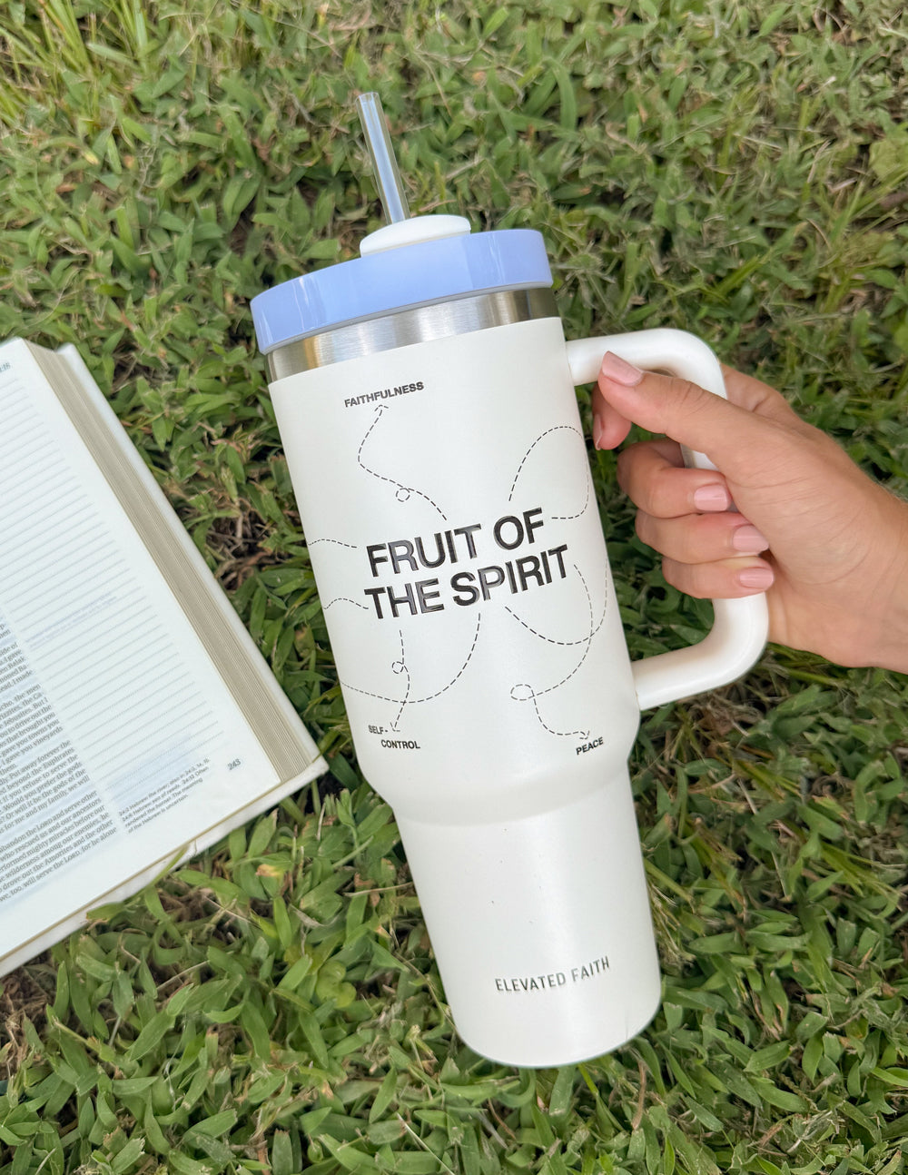 White 40 oz tumbler with handle and straw; silver lid and 'FRUIT OF THE SPIRIT' print