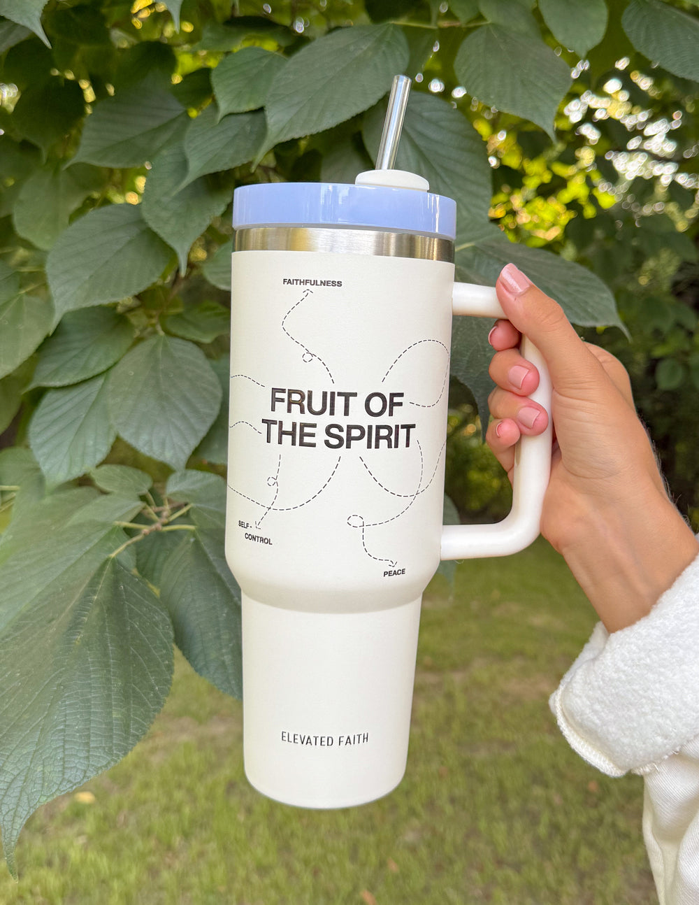 White 40 oz tumbler with handle and straw; silver lid and 'FRUIT OF THE SPIRIT' print