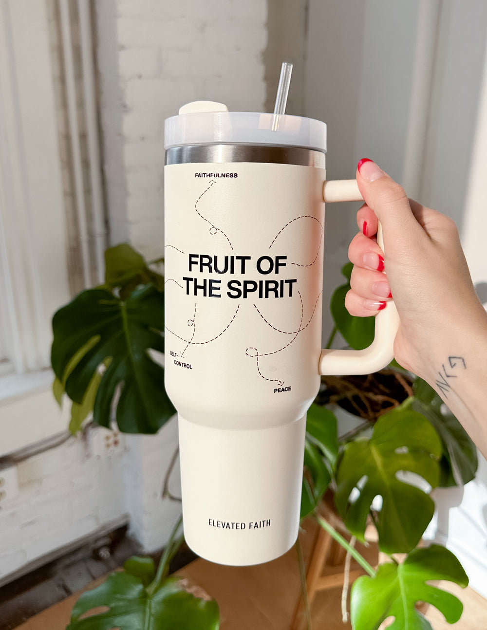 White 40 oz tumbler with handle, straw, and silver lid; 'FRUIT OF THE SPIRIT' text