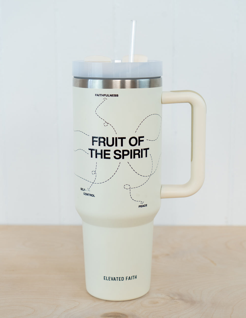 White 40 oz tumbler with lid, handle, and 'Fruit of the Spirit' text