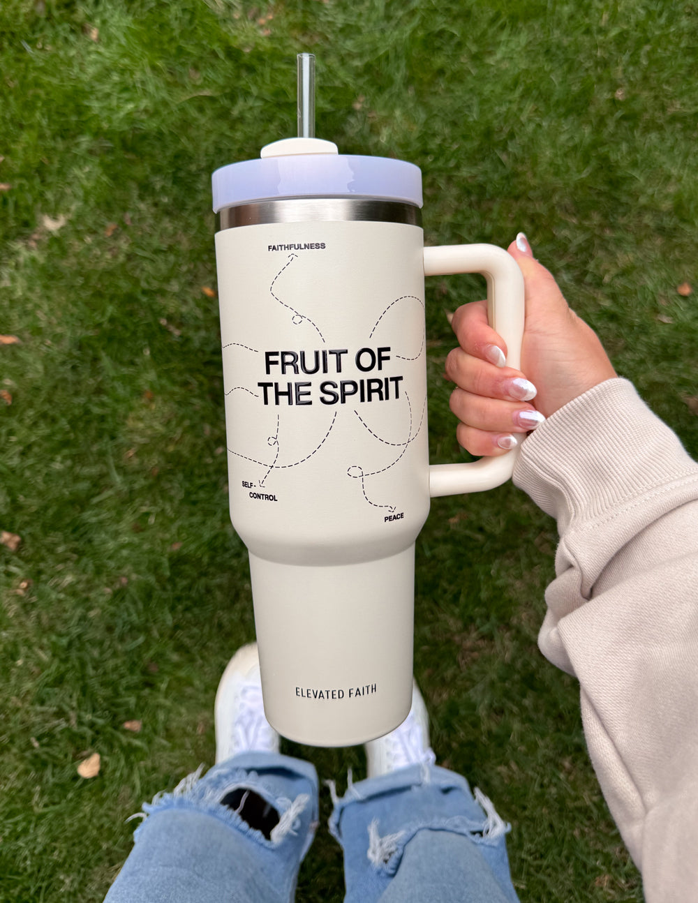 White 40 oz tumbler with straw and handle; silver lid and 'FRUIT OF THE SPIRIT' text