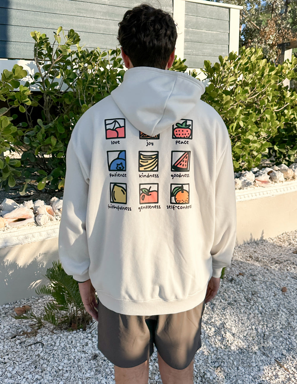 Unisex white hoodie, back view with hood down and colorful square icon grid print