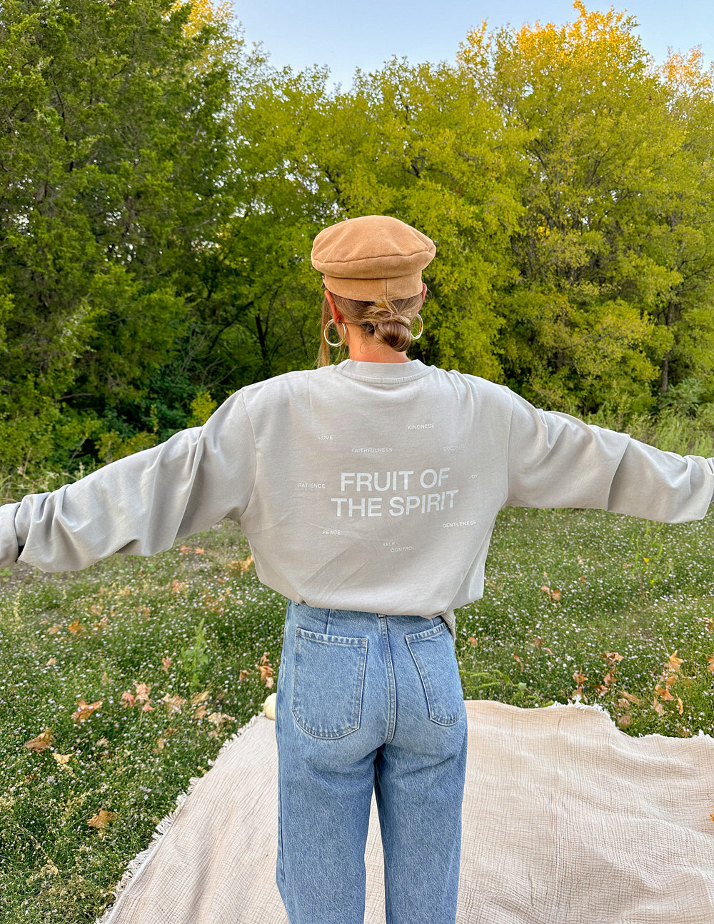 Back view of grey long-sleeve T-shirt with “FRUIT OF THE SPIRIT” centered print.