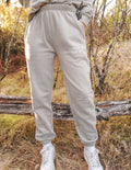 Grey unisex sweatpants with ribbed cuffs and drawstring waistband