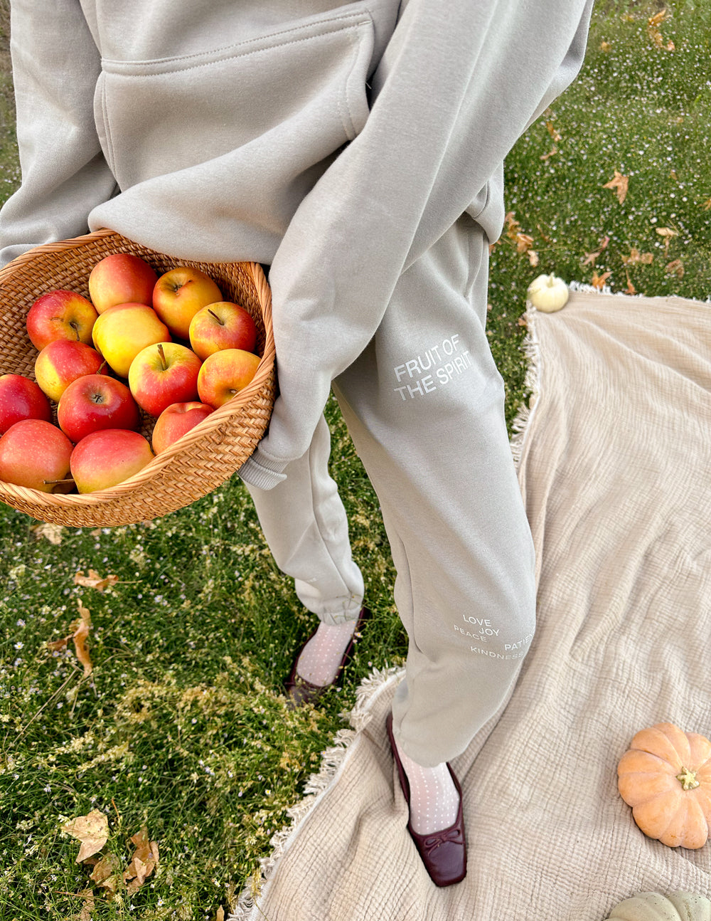 Grey unisex sweatpants with side logo print and elastic ankle cuffs