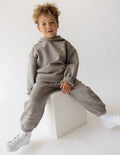 Kids gray hoodie with hood and front pocket, printed inspirational text on chest