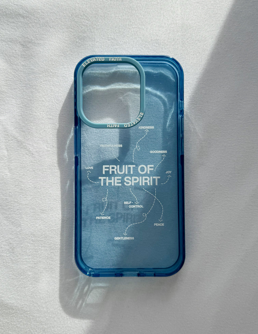 Blue Fruit of the Spirit phone case with clear back, camera cutouts, and word art
