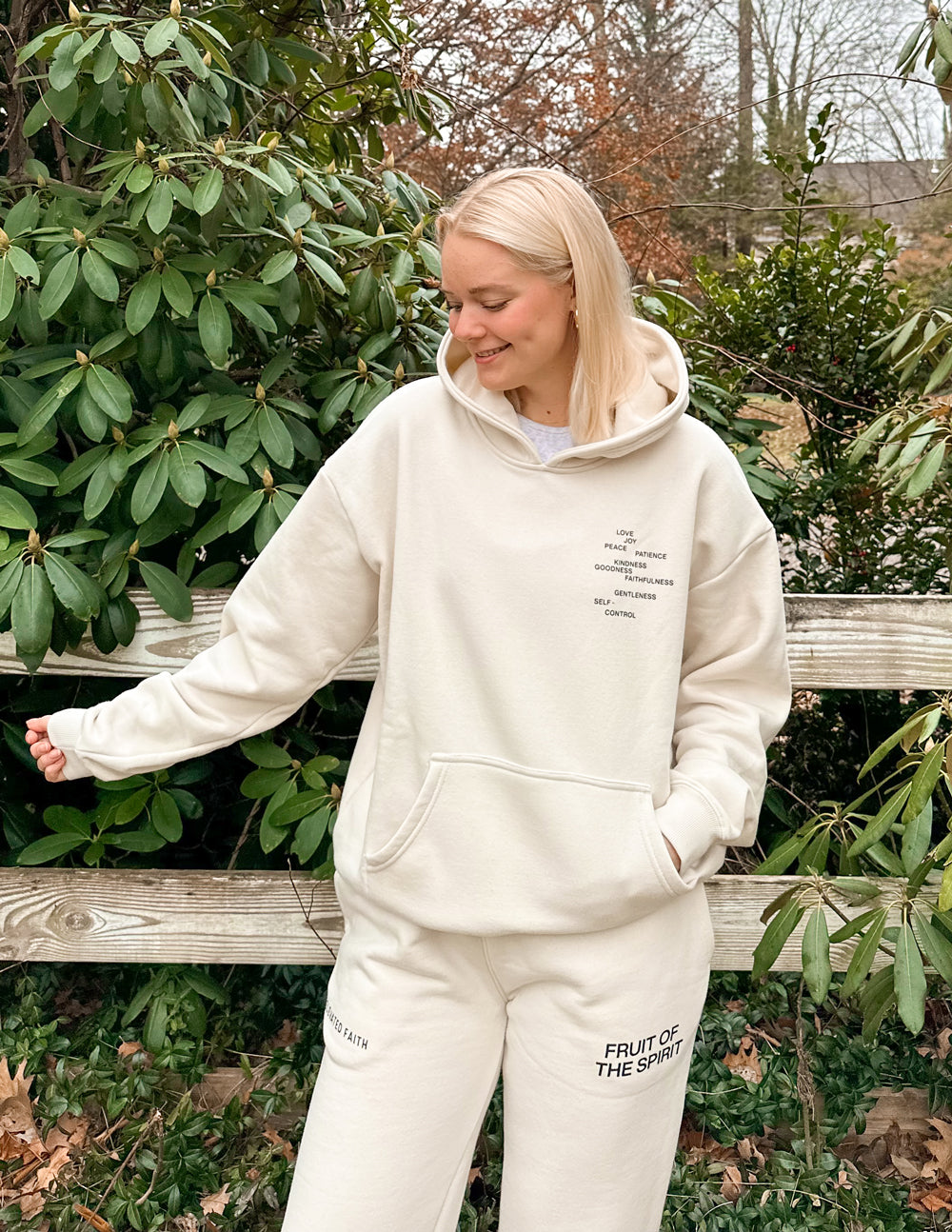 Off-white unisex hoodie with hood, front logo text, and kangaroo pocket