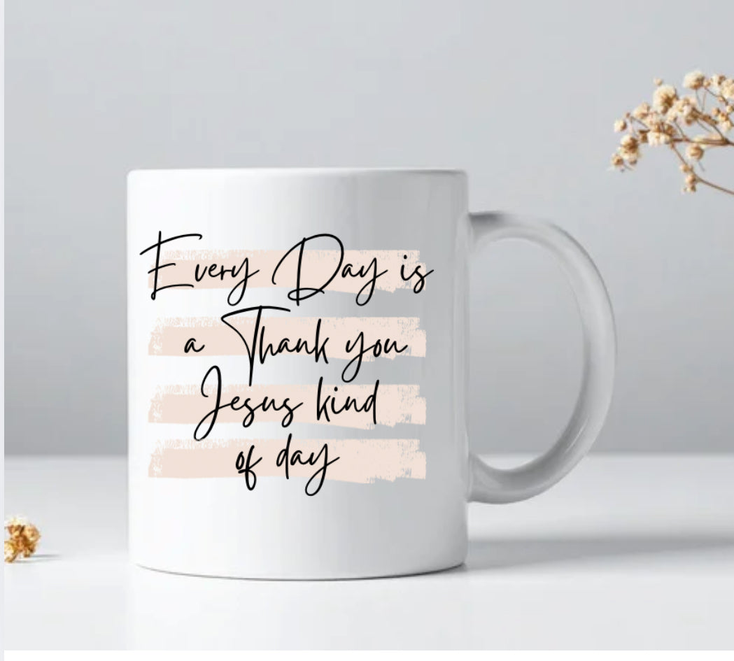White coffee mug with 'Every Day is a Thank you Jesus kind of day' lettering.