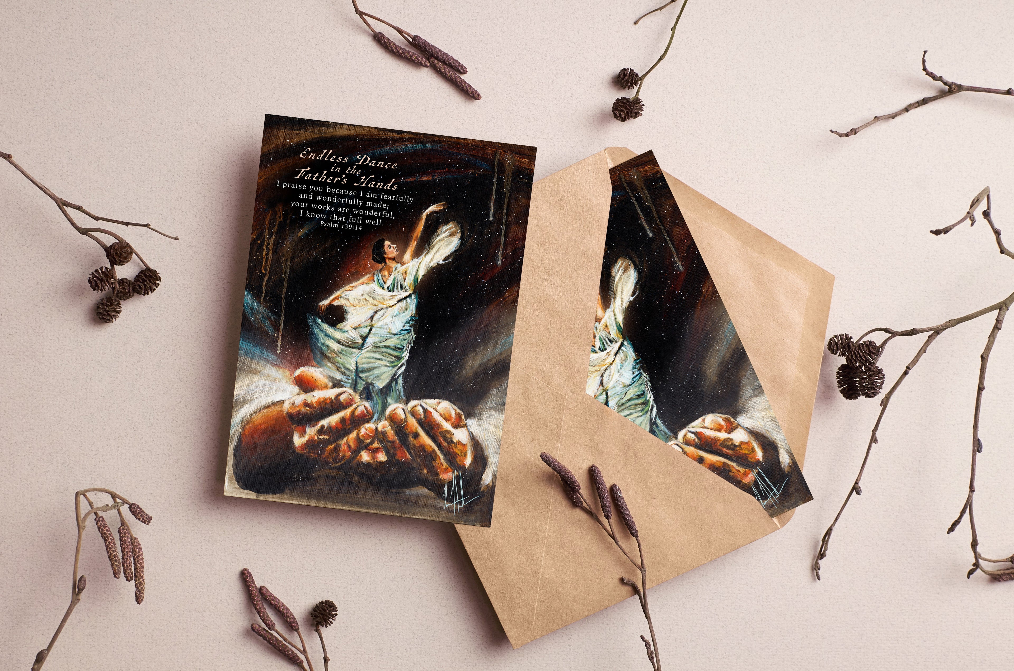 Greeting cards with dark angel artwork and brown kraft sleeves, arranged with twigs.