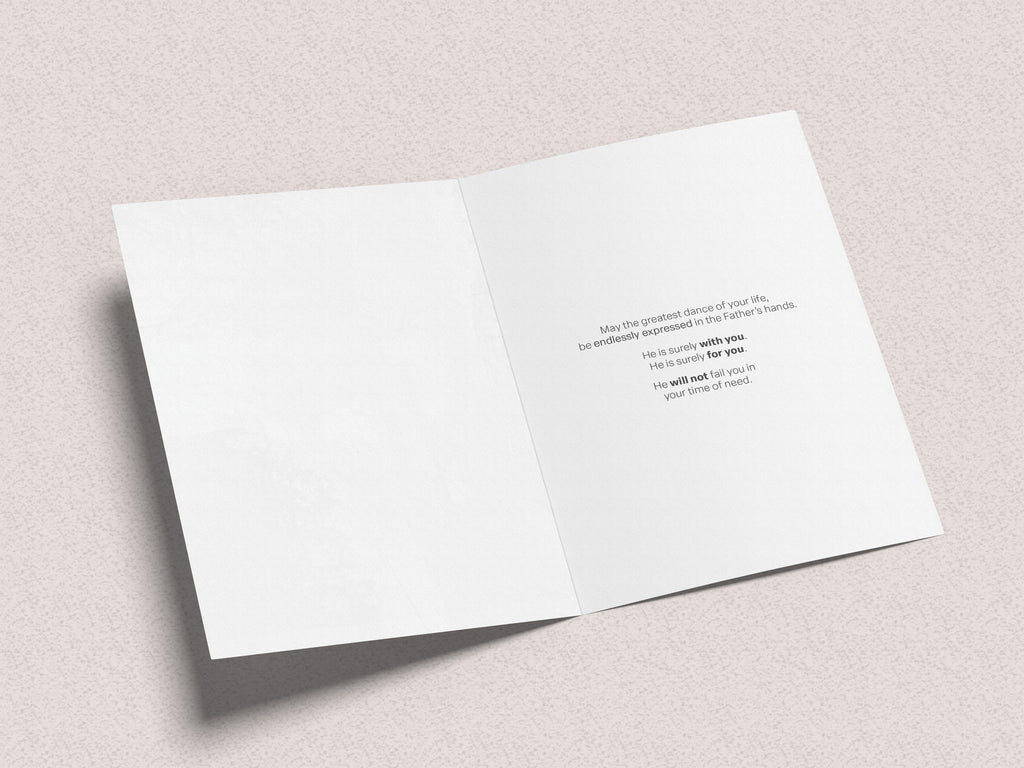 Greeting card inside panel with small printed message on white paper, open flat.