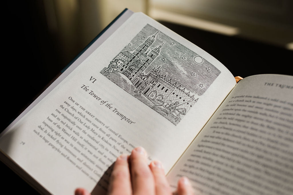 Open book with dense black text and a small black-and-white diagram on the left page.