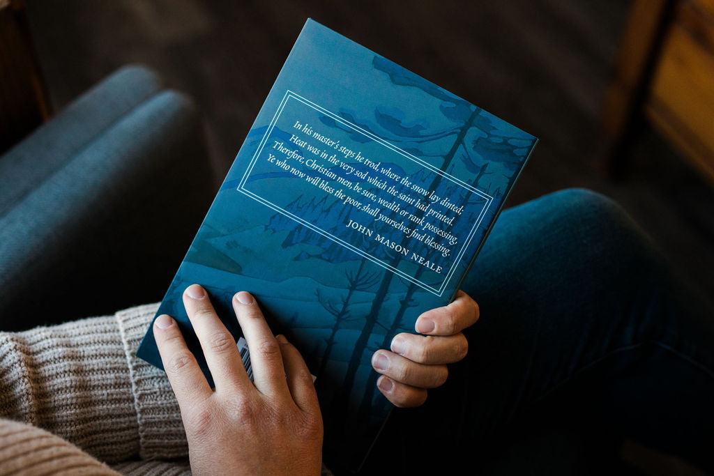 Hardcover book back cover with blue forest silhouette and quote text
