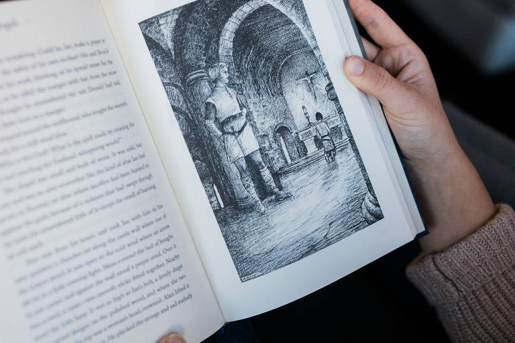 Open book with black-and-white illustration on the right page