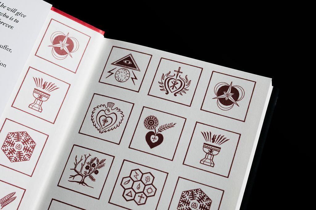 Open Holy Spirit book with decorative icon diagrams across the page spread