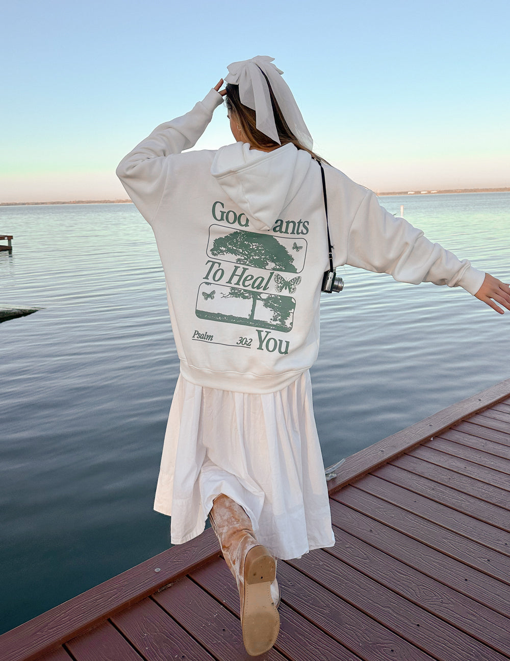 White unisex hoodie with large back text graphic print and front pouch pocket