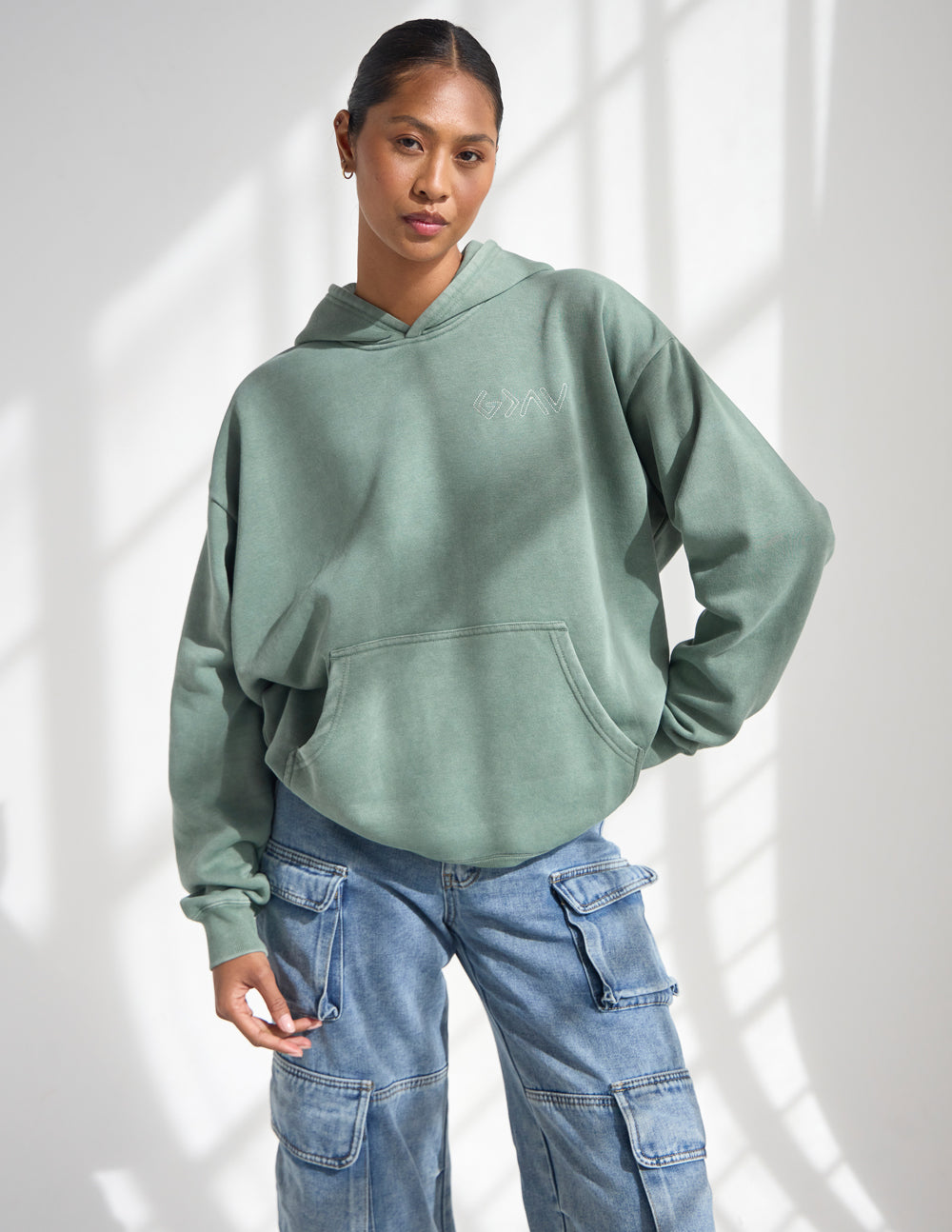Sage green unisex pullover hoodie with front pocket and kangaroo pocket