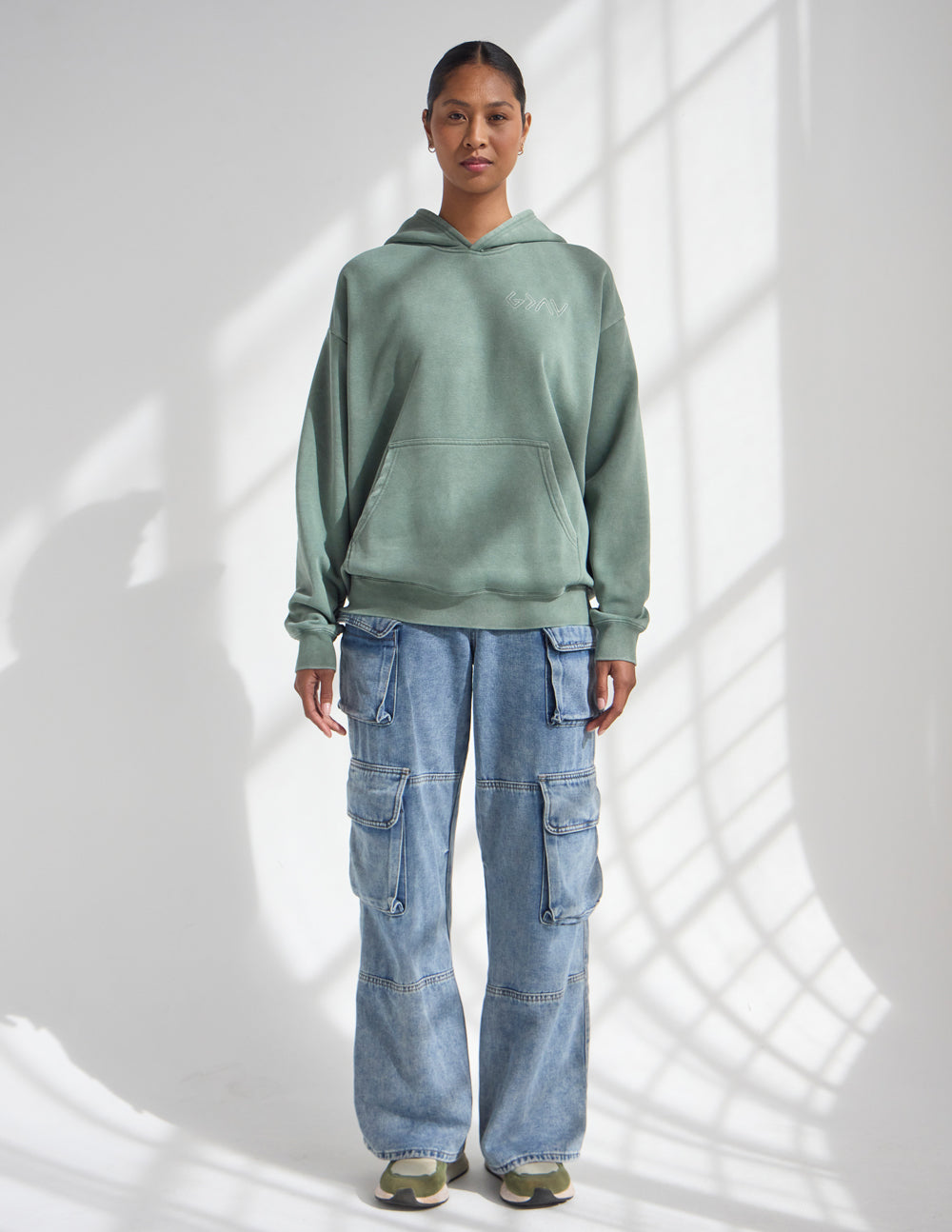 Sage green unisex pullover hoodie with hood and front pouch pocket