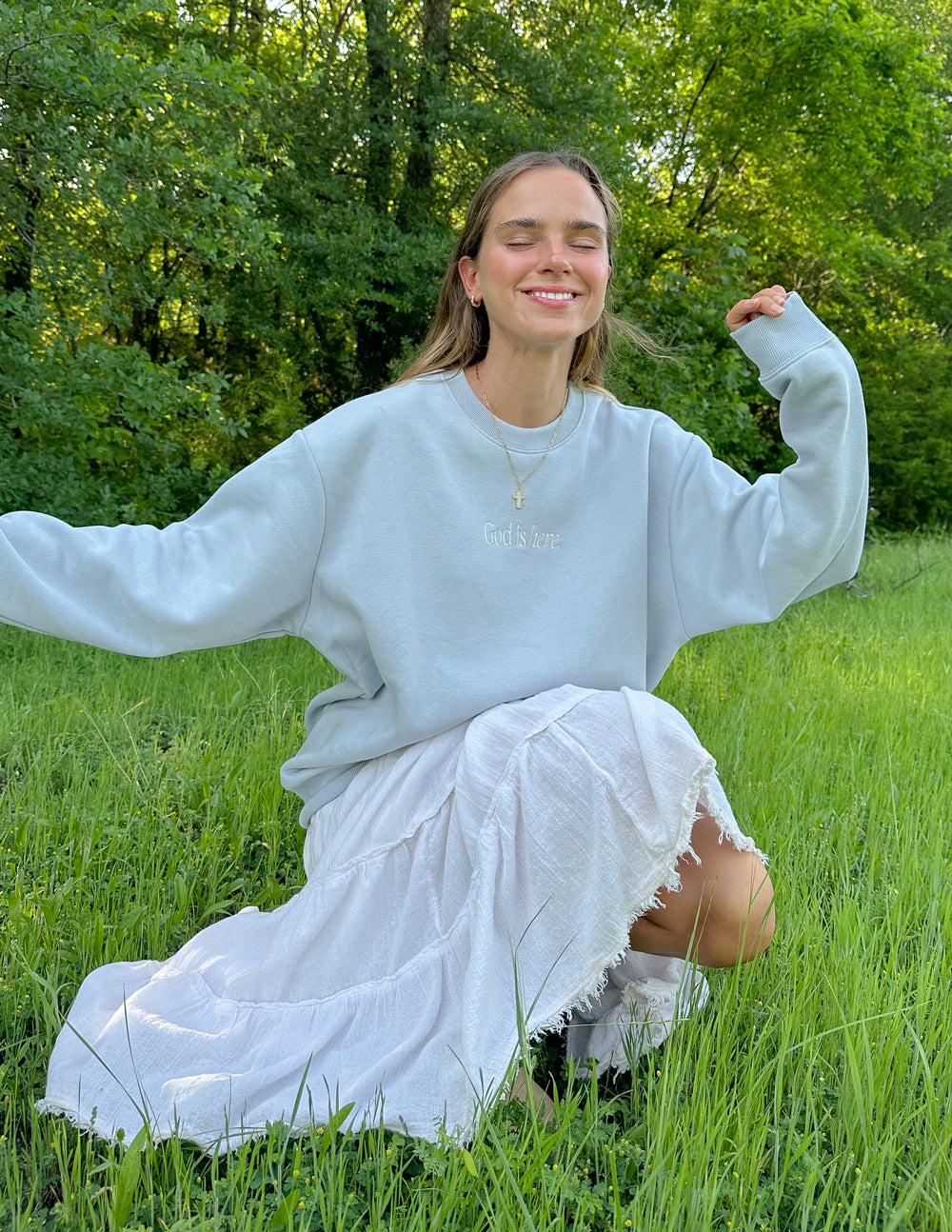 Light blue unisex crewneck sweatshirt with small chest print and long sleeves