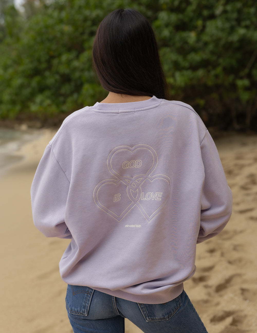 Lavender crewneck sweatshirt back view with centered heart-and-text graphic