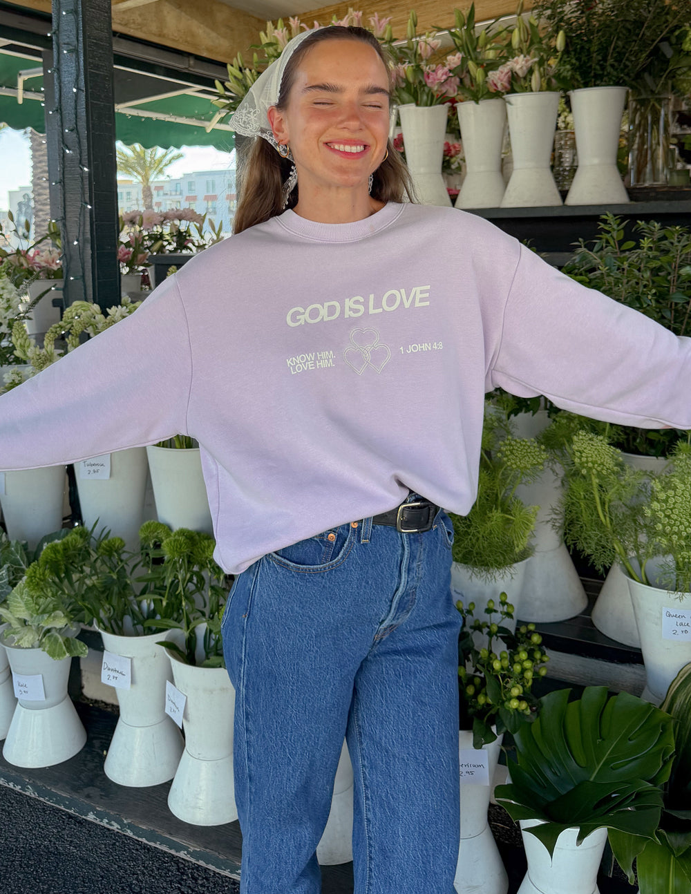 Lavender unisex crewneck sweatshirt front print “GOD IS LOVE” heart graphic