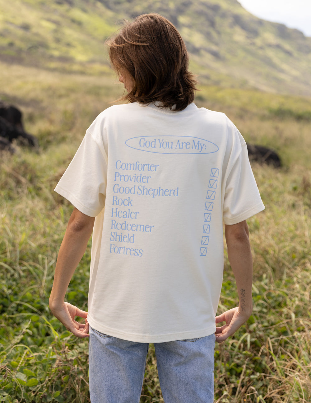 Cream unisex short-sleeve T-shirt with back graphic text and vertical design