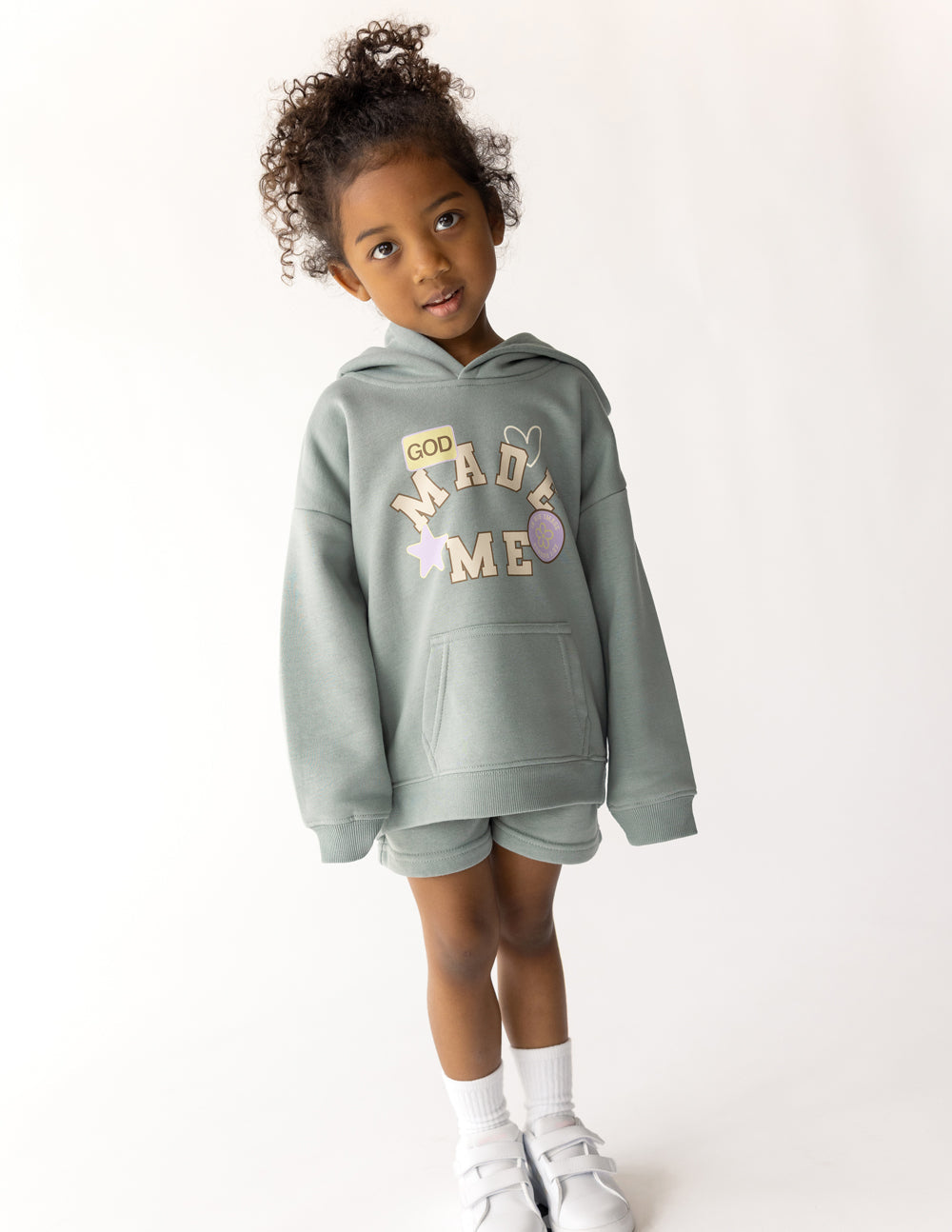 Kids sage green hoodie with hood and "God Made Me" front graphic.