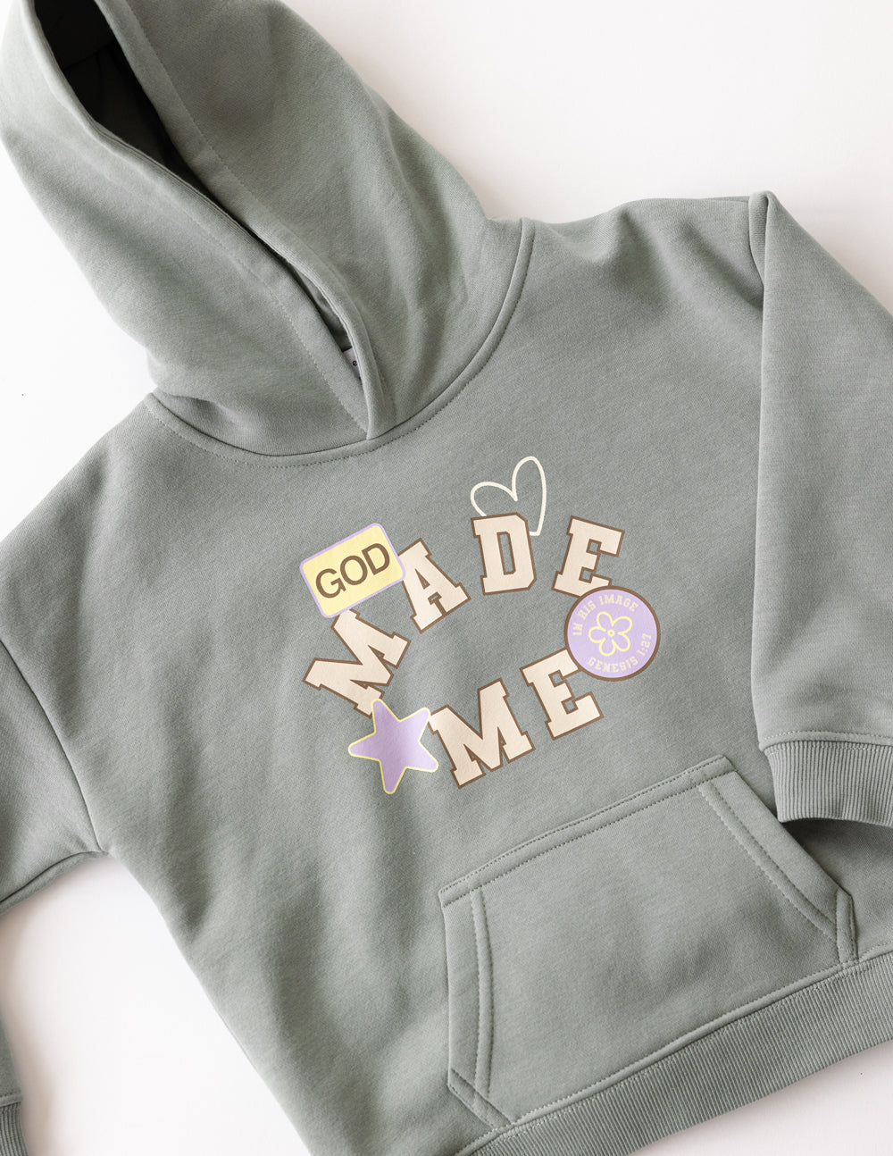 Kids sage green hoodie front graphic with kangaroo pocket detail.