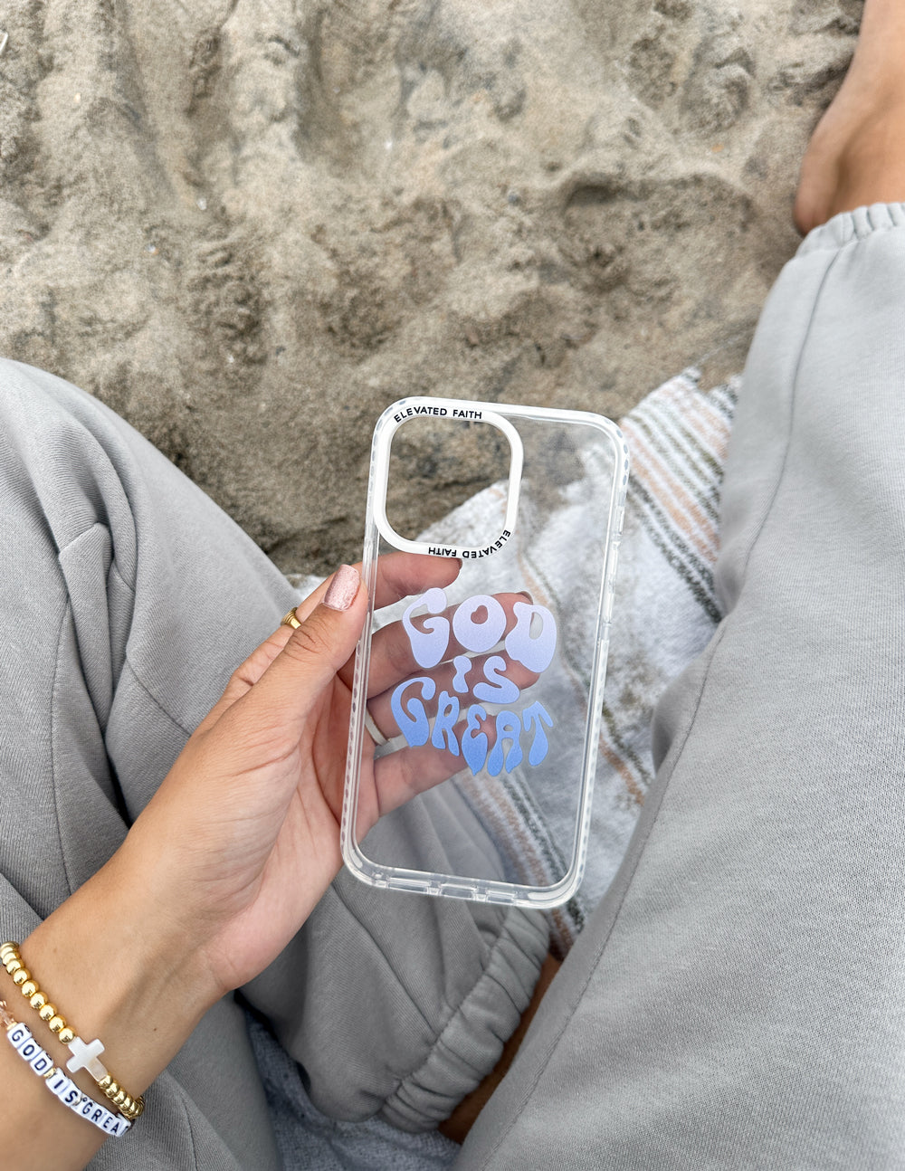 Clear phone case with blue 'God is Great' print and camera cutouts