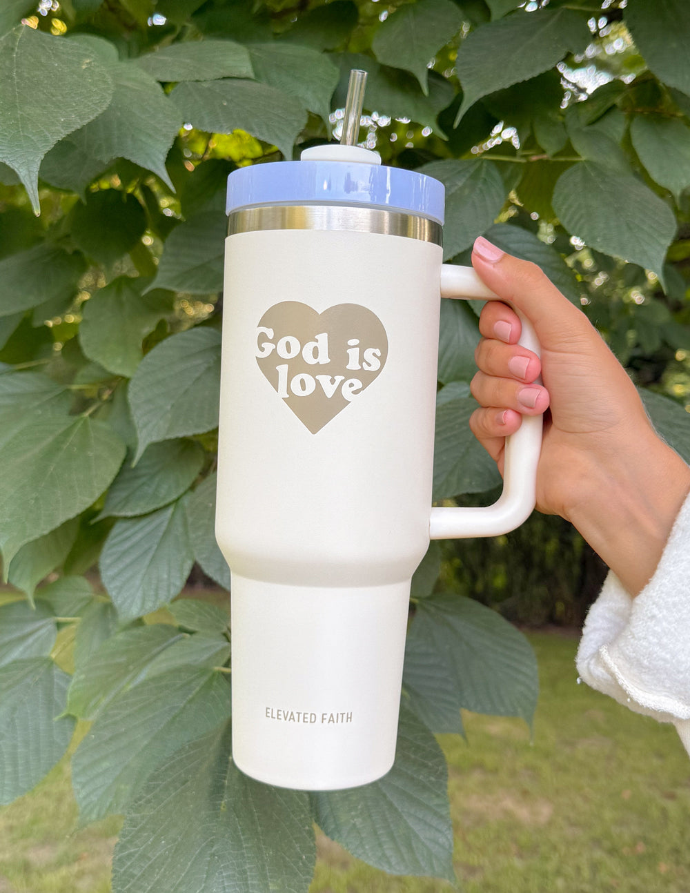 40 oz tumbler with straw, cream body, light blue lid, "God is Love" heart print