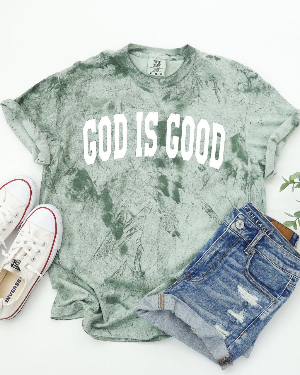 Garment-dyed crewneck T-shirt in sage green with 'GOD IS GOOD' front print