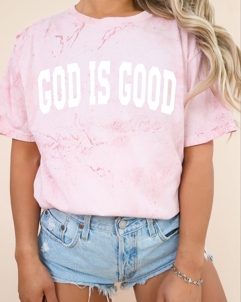 Garment-dyed crewneck T-shirt in pink with 'GOD IS GOOD' front print