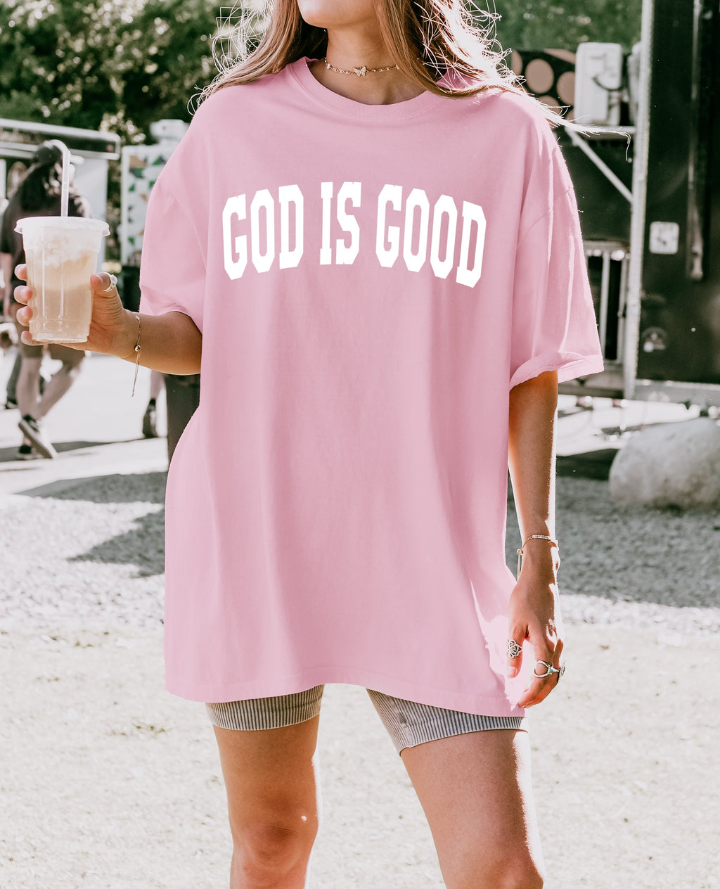 Light pink garment-dyed crewneck T-shirt with “GOD IS GOOD” front print