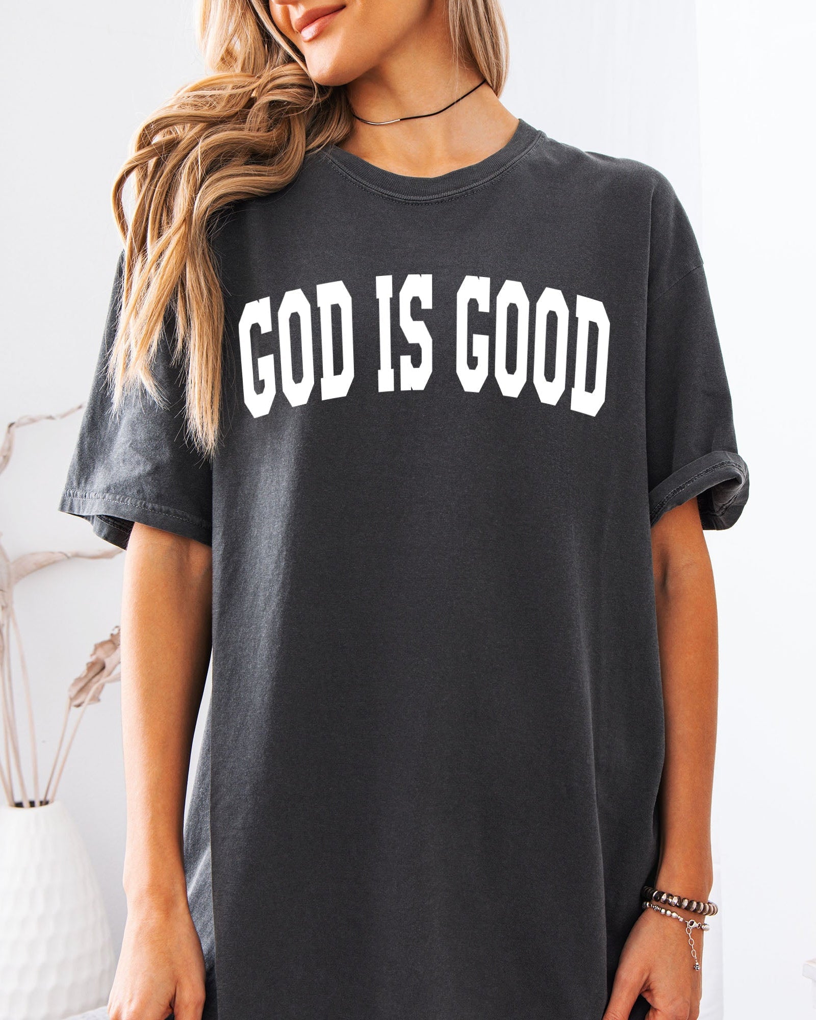 Dark gray garment-dyed crewneck T-shirt with “GOD IS GOOD” front lettering