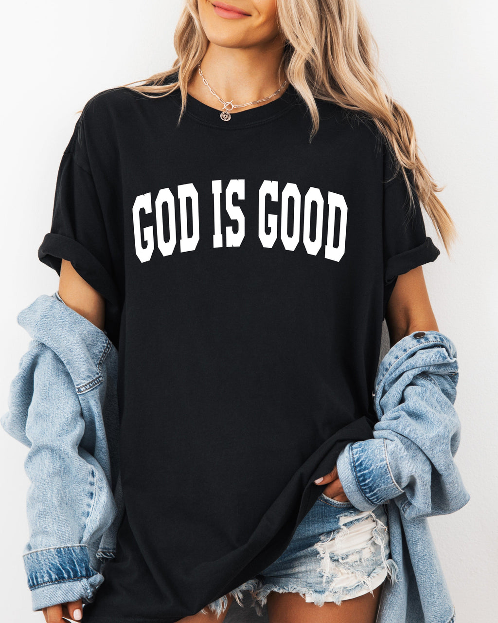 Black garment-dyed crewneck T-shirt with “GOD IS GOOD” front lettering