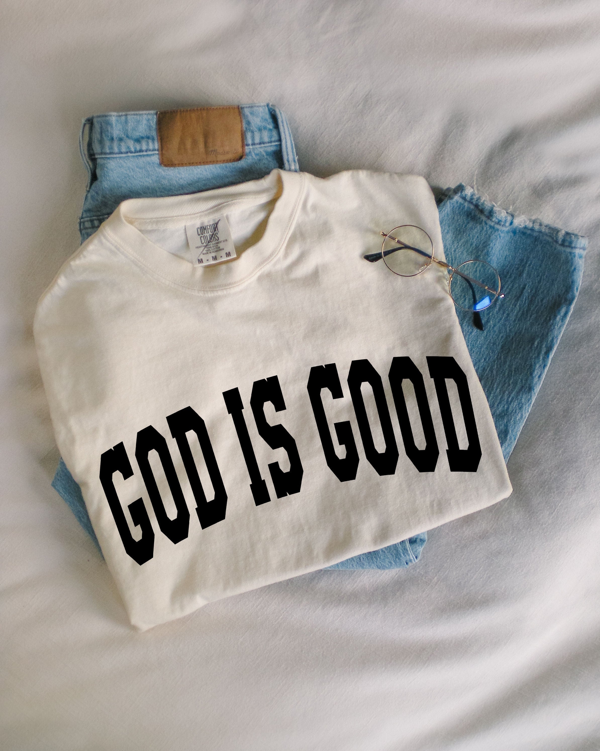 Garment-dyed crewneck T-shirt in off-white with 'GOD IS GOOD' front print