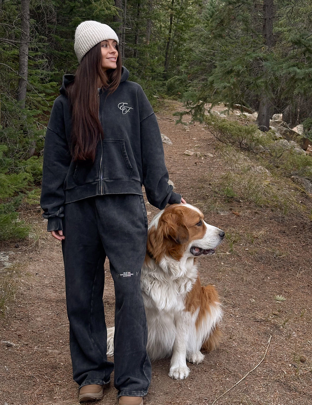 Dark charcoal full-zip hoodie with front zipper and chest logo, hood up
